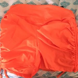 Orange stretch shorts